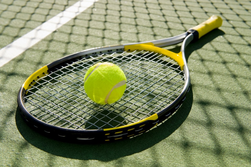 Tennis Racket and Ball on Court